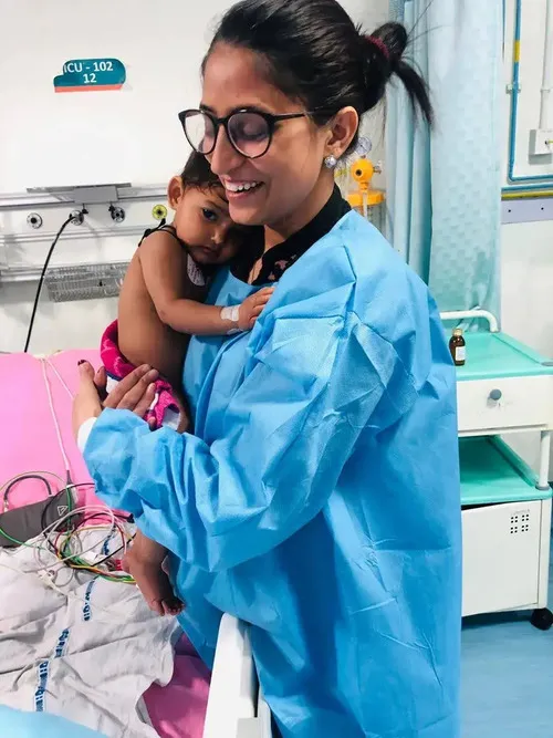 Dr. Sumitra Meena with a baby